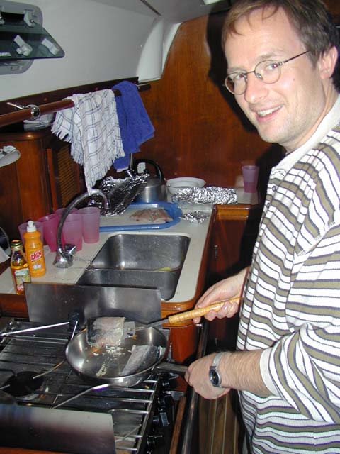 48 Michel cooks his fish.jpg