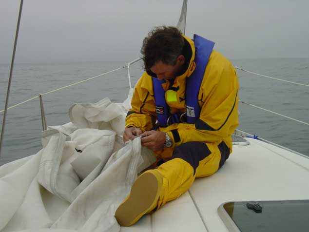 DSC00251 Tape did not work, Tom sewing the sail